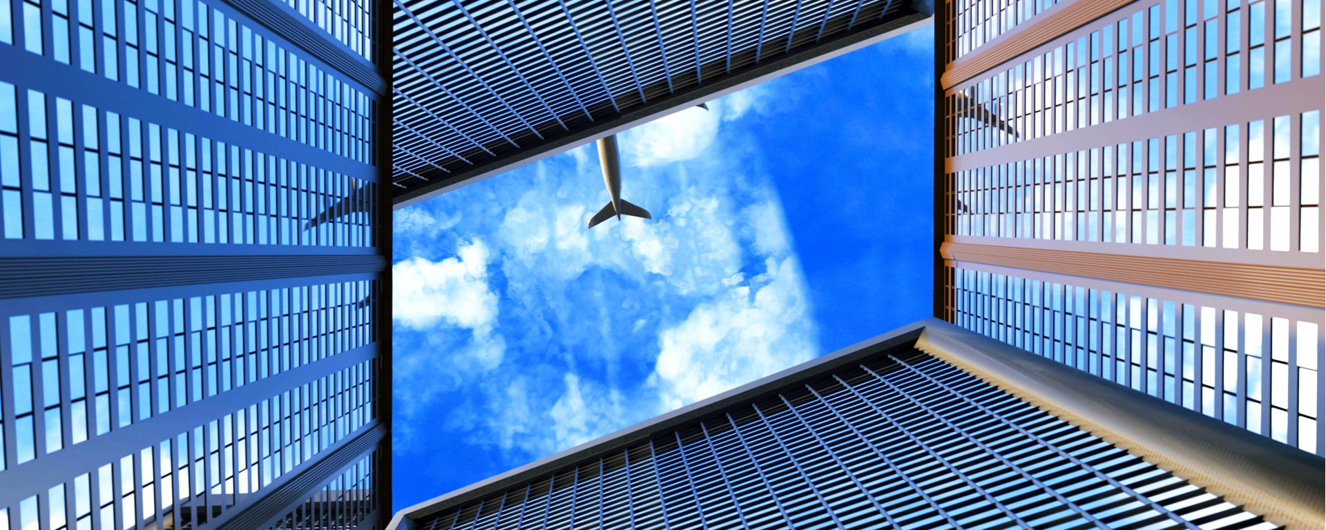 Airplane flying over buildings.