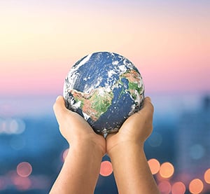 Hands holding a globe